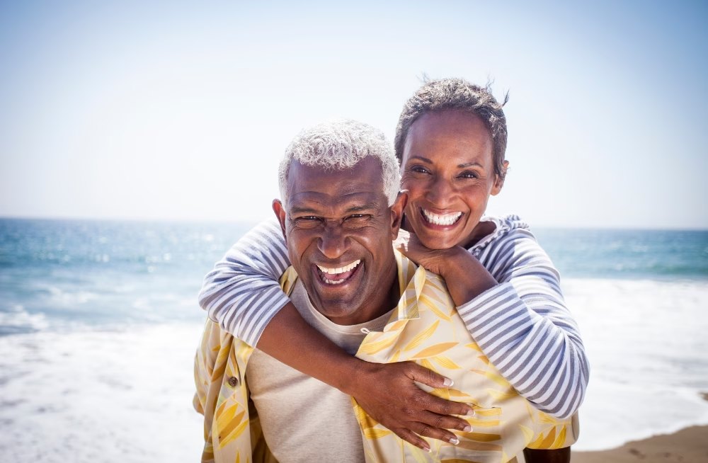 An older Dallas couple discussing final expense insurance at their kitchen table